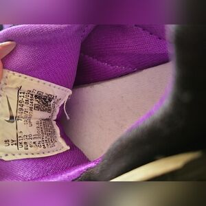 Girls Nike size 1y purple/white and black.